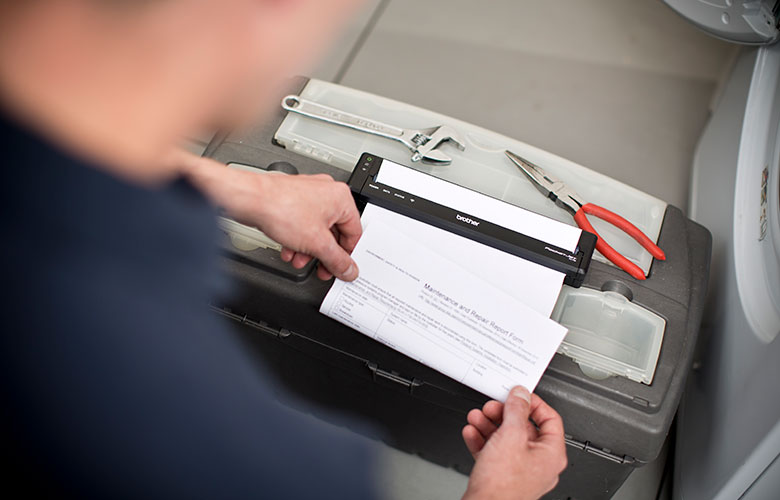 Brother PJ printer printing A4 paper on top of workman box