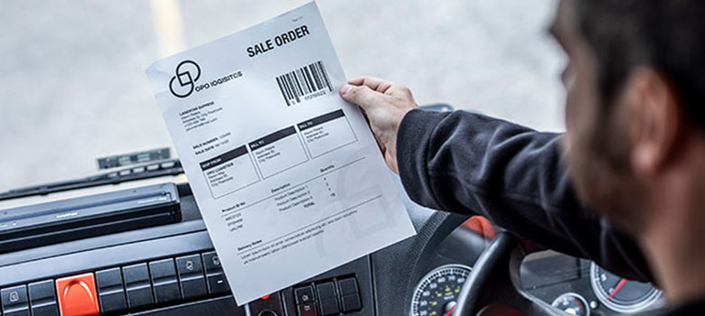 Direct store delivery sales order held above dashboard by driver