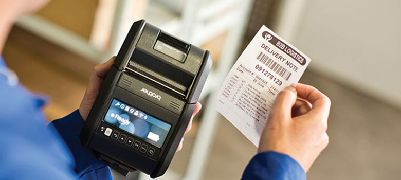 Direct store delivery receipt printed from Brother RJ-3 printer held in hand