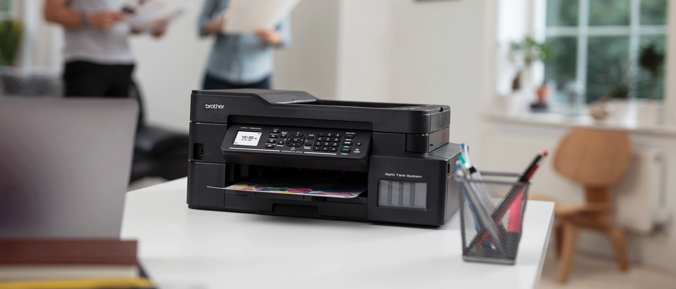 Brother MFC-J895DW inkjet on desk with laptop