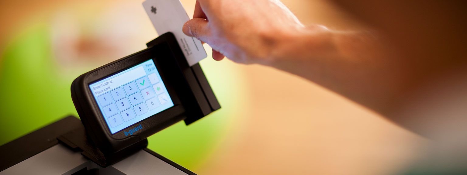 Person using ID cards to use Brother printer