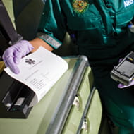 Emergency services worker using Brother PJ mobile printer to print medical document