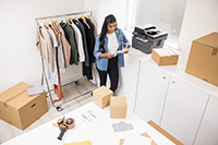 Woman in small business viewing mono output