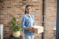 Woman holding box of supplies