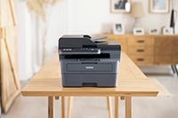 Brother printer sat on long wooden table