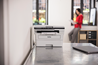 Printer on a desk in home office environment