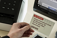 QL-810W z nalepko s črno-rdečim izpisom