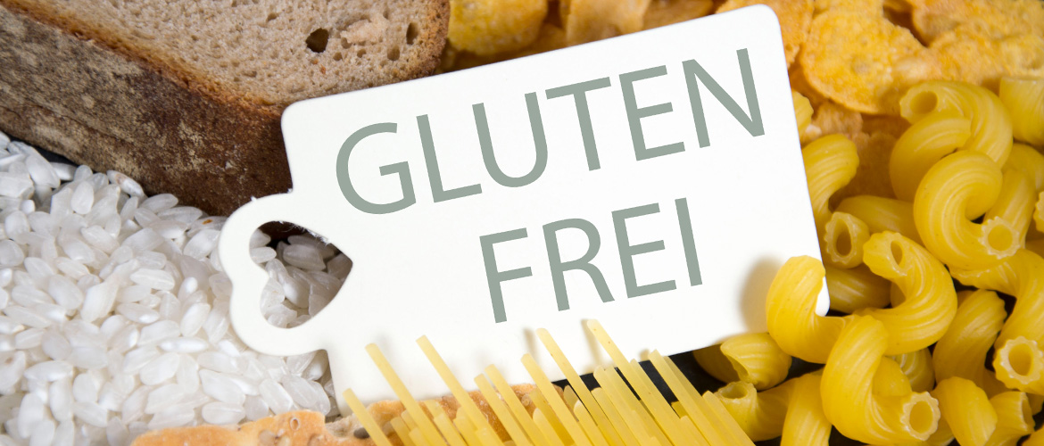 Brot, Reis, Cornflakes und Verschiede Nudelsorten, in der Mitte ein Etikett mit der Aufschrift Glutenfrei