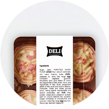 Rosa und weiße Cupcakes in einem einer Verpackung auf die Lebensmitteletiketten geklebt sind