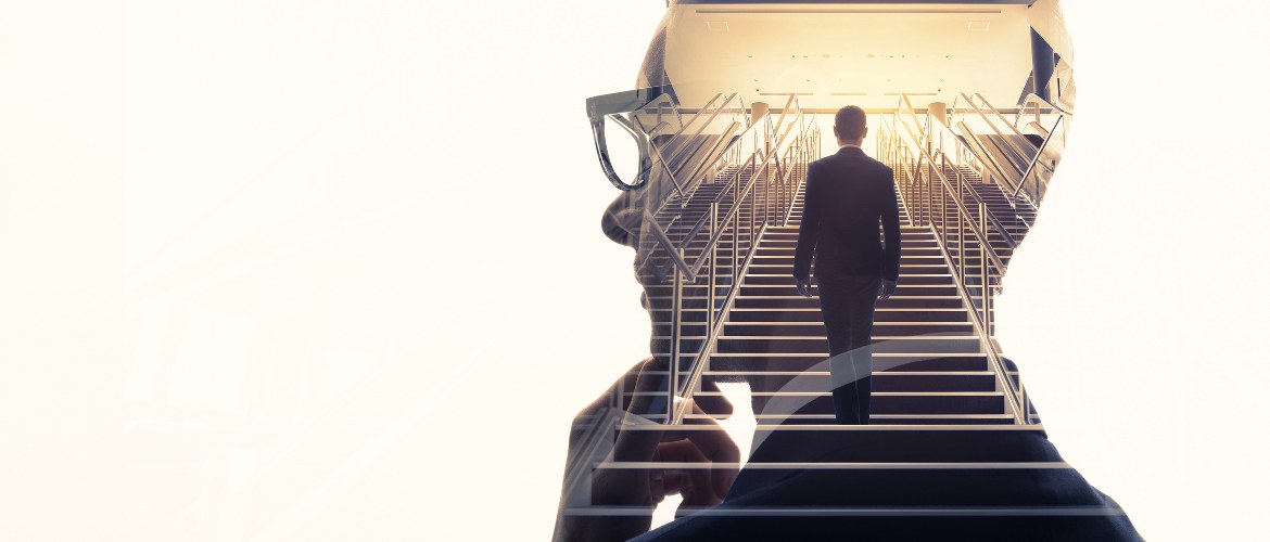 Office of the future image depicting a thinking man in a suit and a staircase of a business