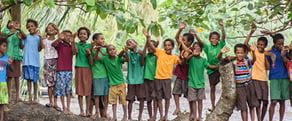 Brother earth photograph taken of children playing in the rainforrest village