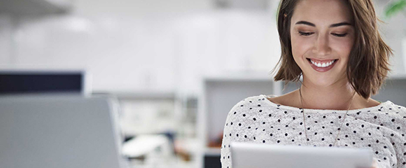 Woman searching for the latest brother news and stories on her tablet