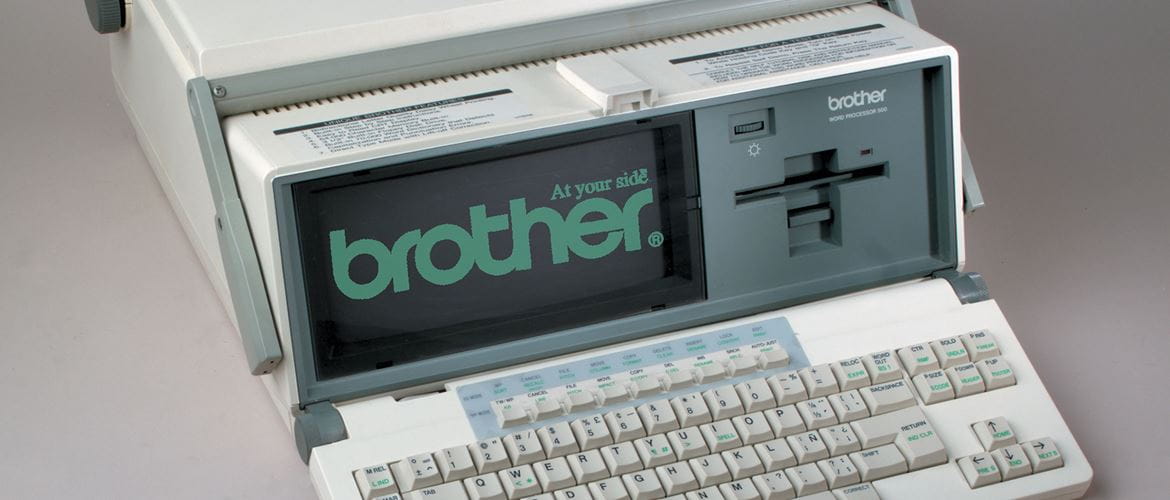 An old word processor machine with Brother logo on the screen