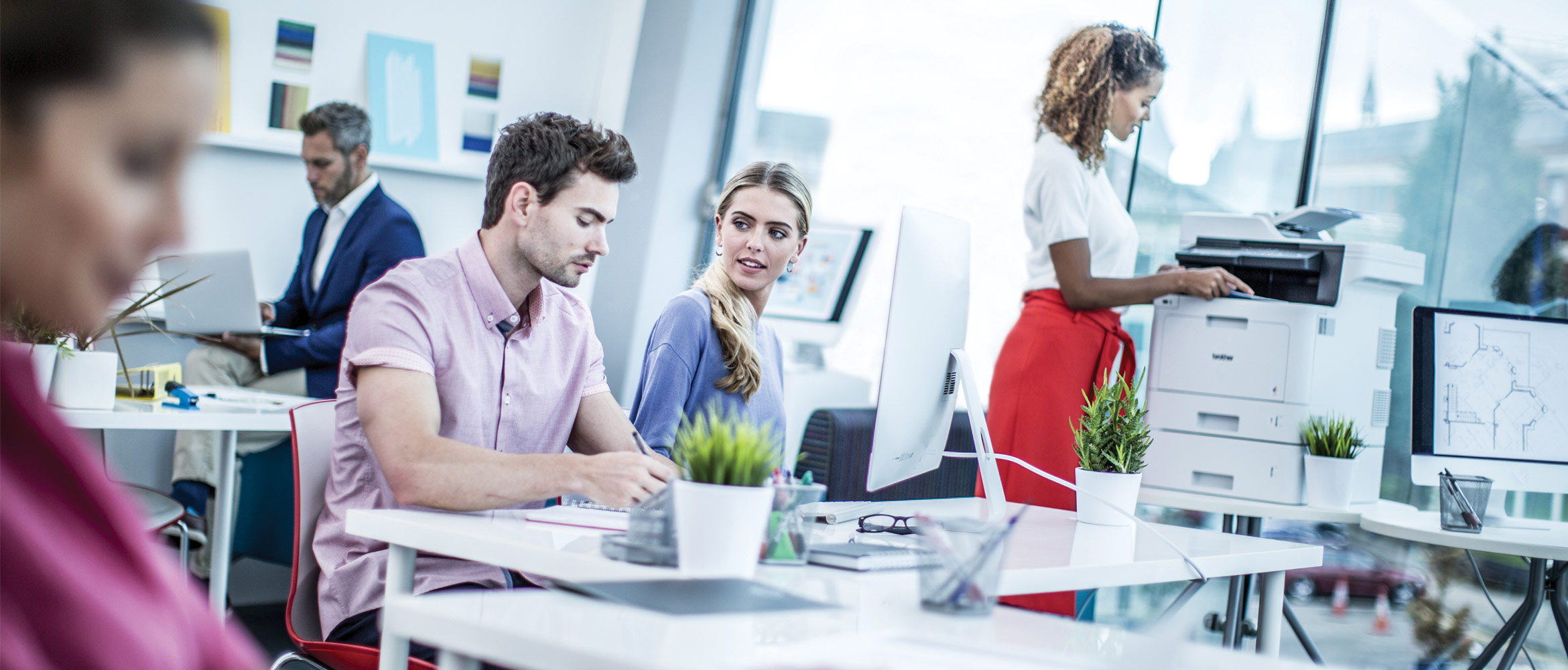Five colleagues work together in their office 