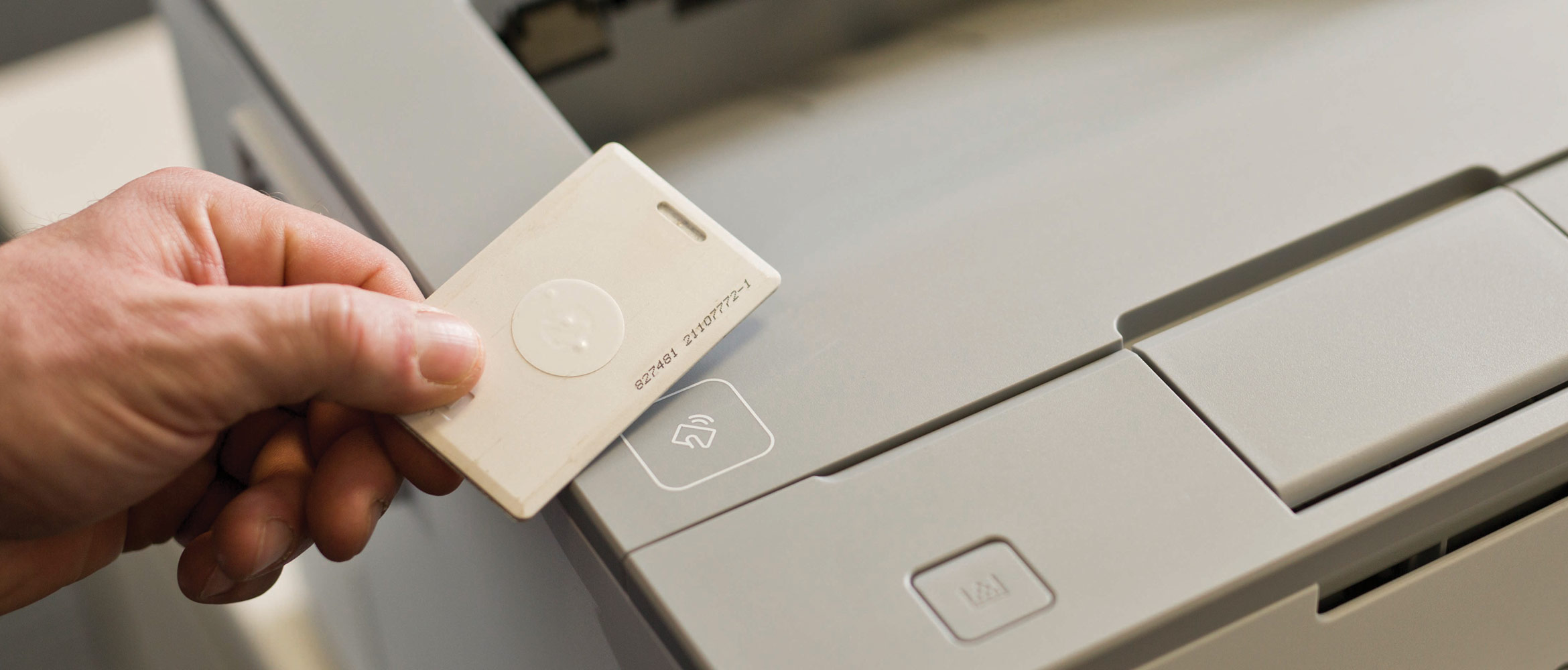 Man uses Brother PrintSmart Secure Printing service at Brother printer