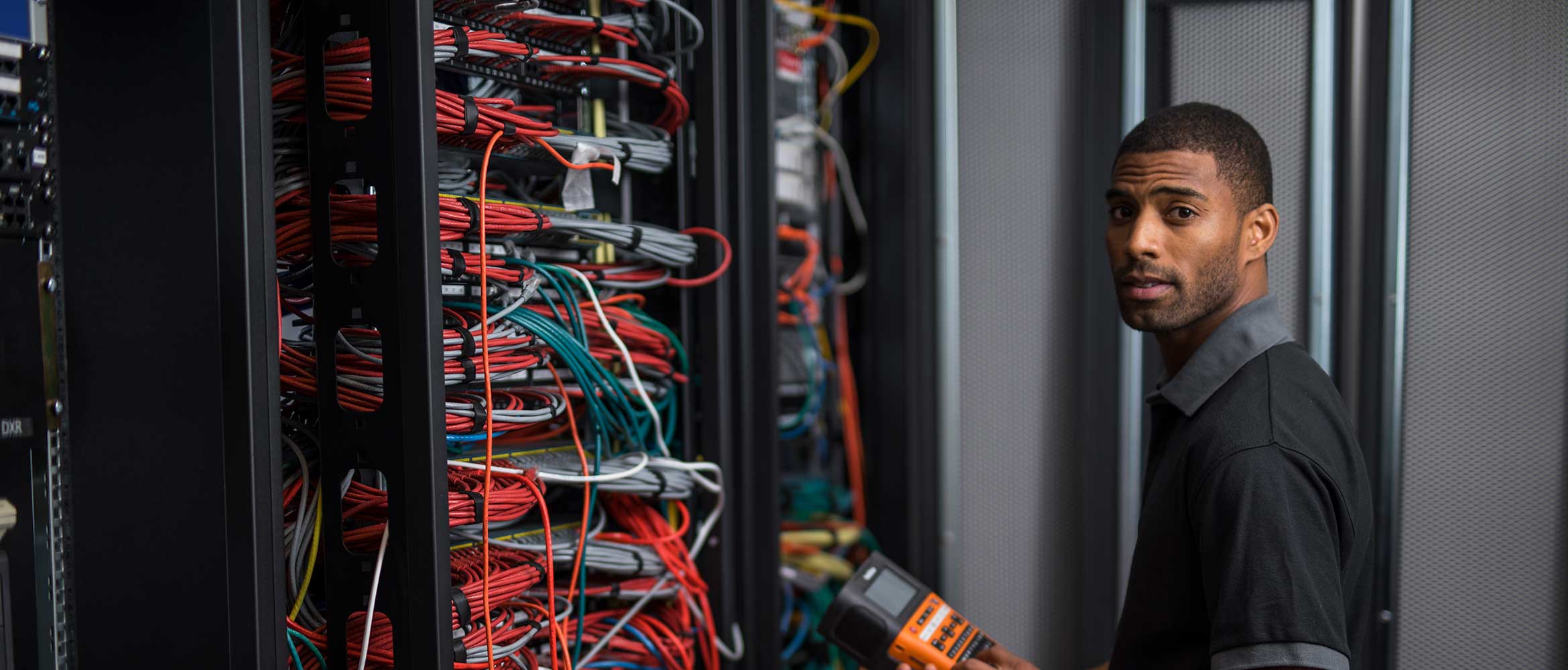 Network installer in front of network switches and cables