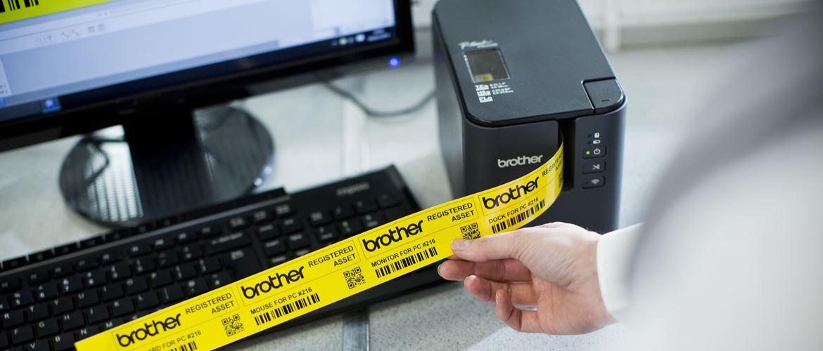 P-touch P900W label printer with yellow Pro Tape being printed