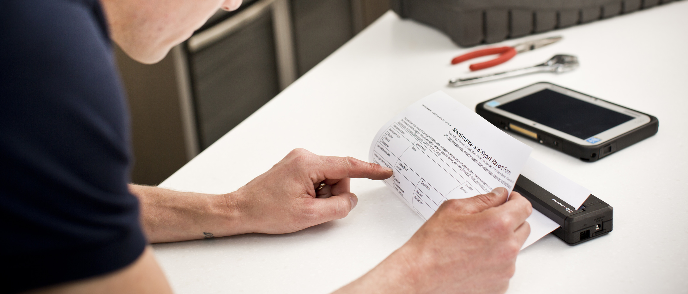 Man printing A4 document on PJ after fixing washing machine