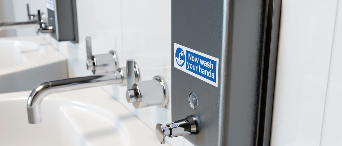 Soap dispenser in hospital bathroom with a Brother durable P-touch TZe label attached