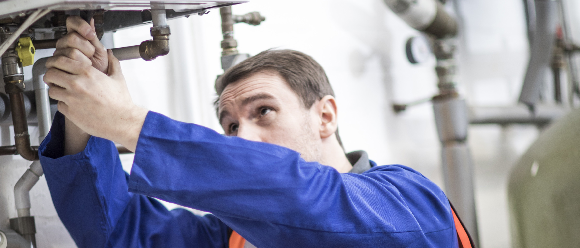 Man fixing gas pipes