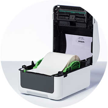 Brother TD-4D desktop label printer open with label roll inside