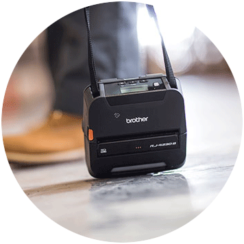 Brother RJ-4 rugged mobile printer dropped on floor with shoulder strap