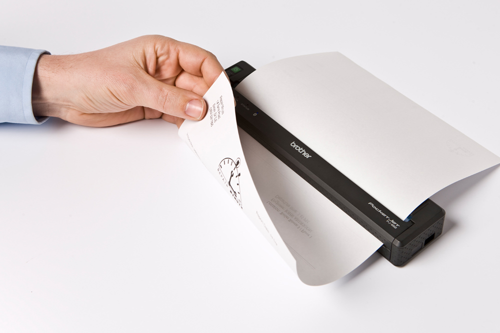 Man holding document printed from PJ