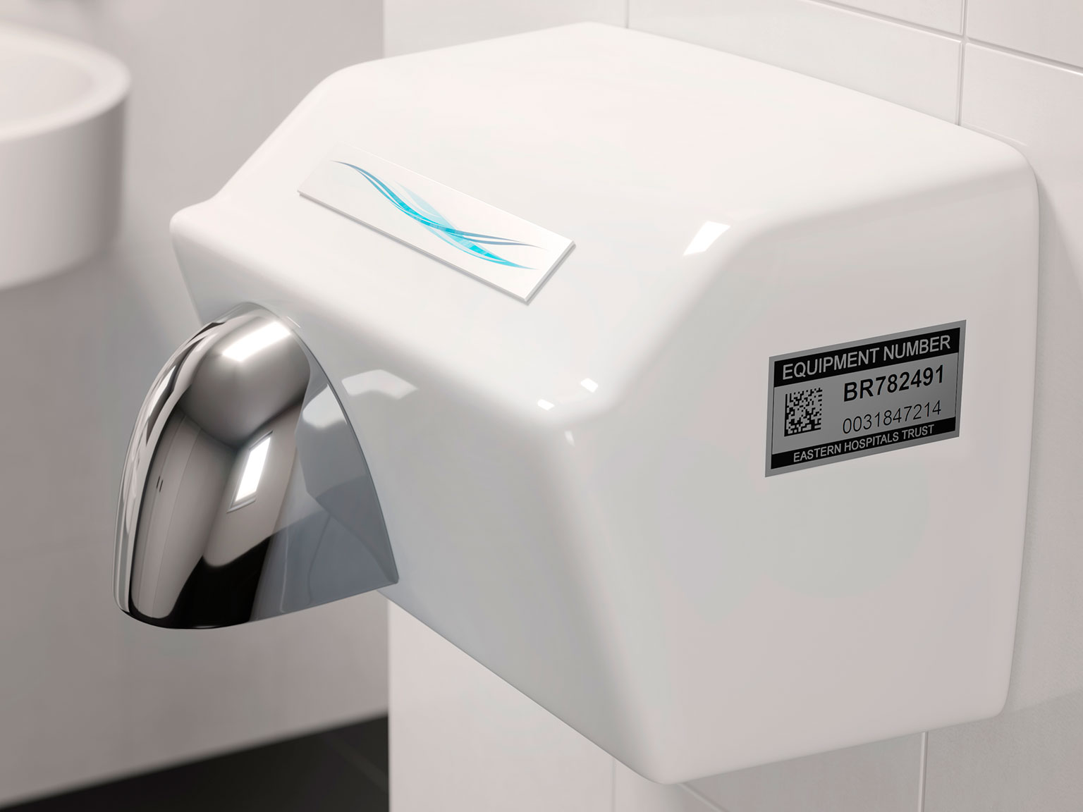 Black on silver P-touch TZe laminated label on a hand dryer