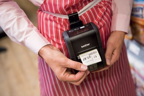 Brother RJ portable label printer with price label being printed