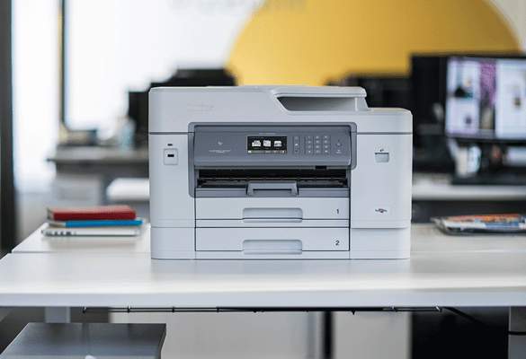 Brother multifunction inkjet printer sat on desk in office 