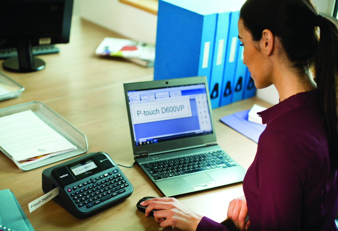 Lady using Brother PT-D600 label printer