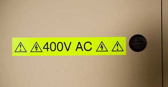 Brother fluorescent tape warning sign showing 400 volts AC