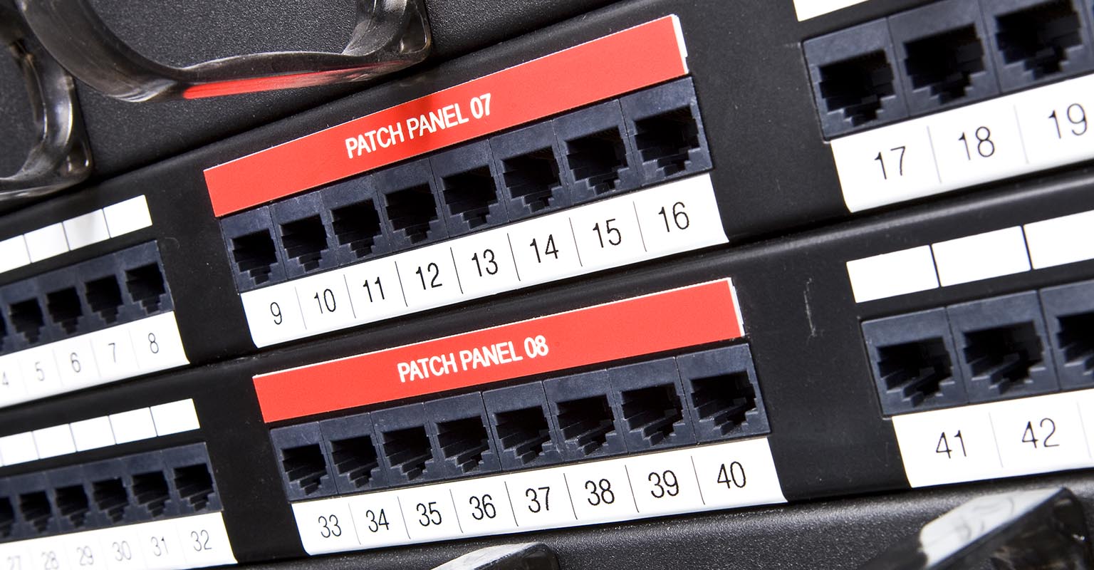 Standard P-touch TZe labels on a network patch panel