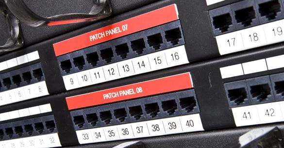 Standard P-touch TZe labels on a network patch panel