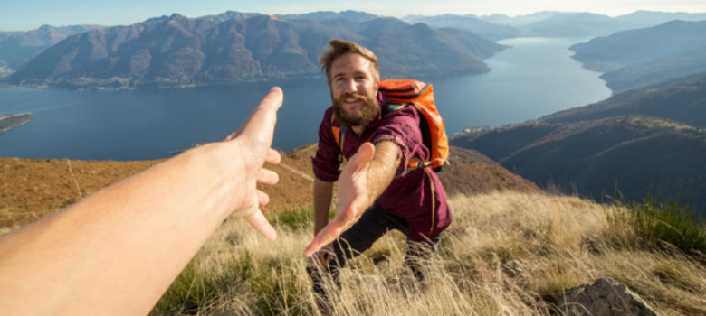 Hiker reaching out for help