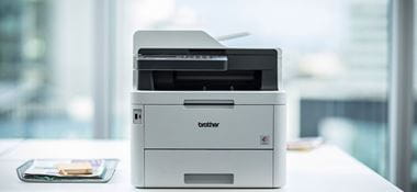 Brother MFC-L3270CDW colour laser printer on white table in office