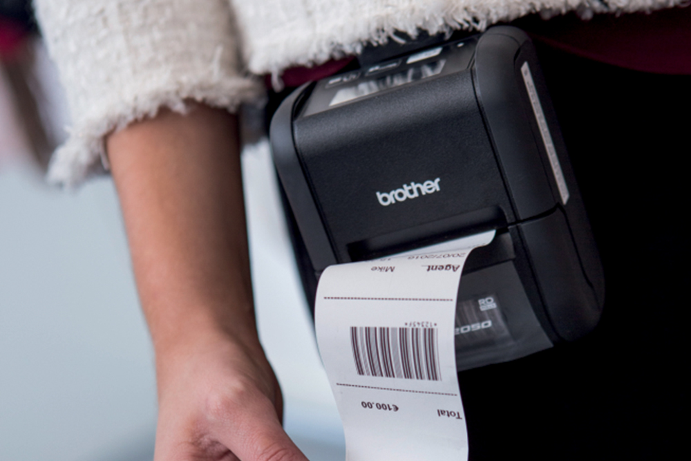 Printed receipt on an RJ-2000 attached onto shop workers belt