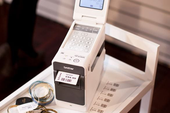 Brother TD-2000 series label printer on mobile trolley with barcode price label printed
