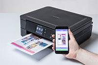 Black inkjet printer with colourful output and mobile phone - DCP-J772DW