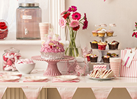 Table laid for afternoon tea with labelled jar in the background