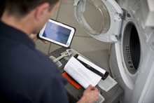 Service engineer with tablet PC printing