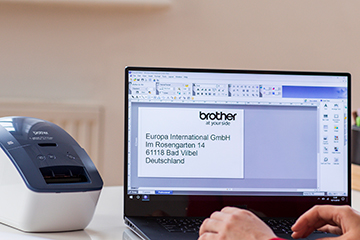 Office worker designing a label on Brother P-touch Editor label design software