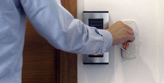 Man entering room with ID card