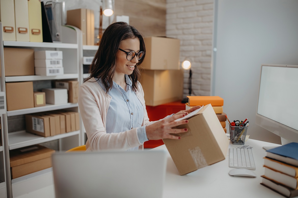 micro business owner packing orders from home office