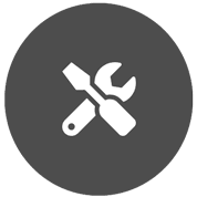 White spanner and screw driver icon on grey circle