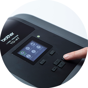 Brother TD-4T desktop label printer with finger pressing buttons