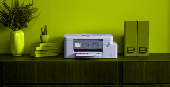 Brother EcoPro printer on a shelf with books and documents