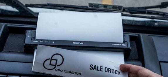 Brother mobile document printer in vehicle dashboard printing document
