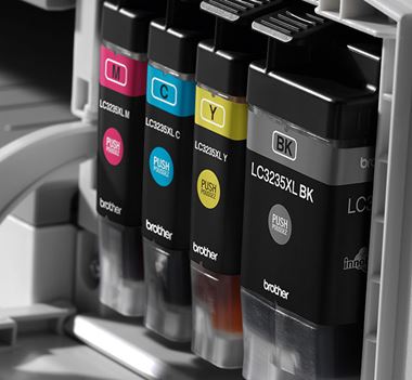 Close up of cyan, magenta, yellow and black in cartridges in a printer