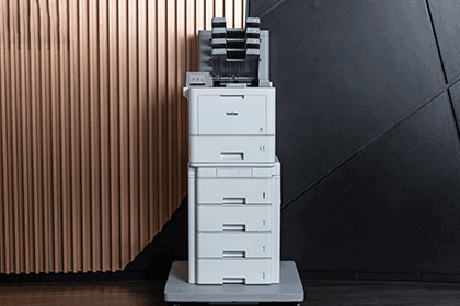 Printer  on a tower tray with a mailbox against copper and black wall
